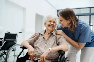 A caring nurse and an elderly patient sharing a heartfelt conversation in a hospital corridor, providing emotional support and reassurance.